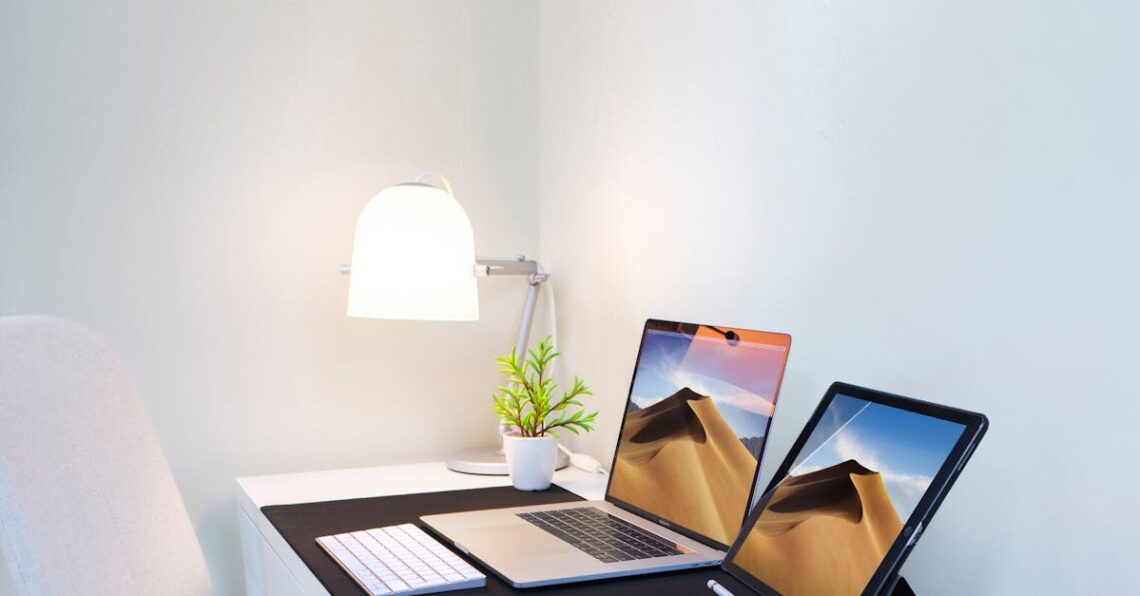 Stylish home office desk with dual screens and minimalist decor. Perfect for remote work and productivity.